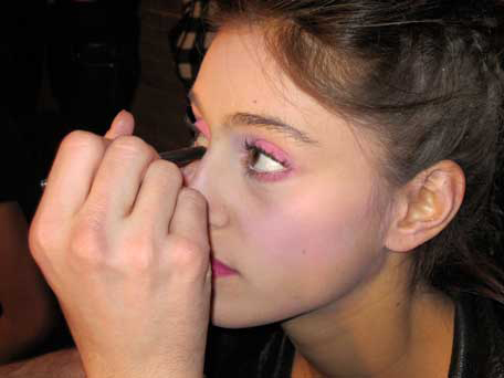 makeup-artist-applying-eyeshadow-backstage-at-bensoni-fw11