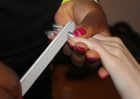 filing-nails-backstage-at-creatures-of-the-wind-ss15