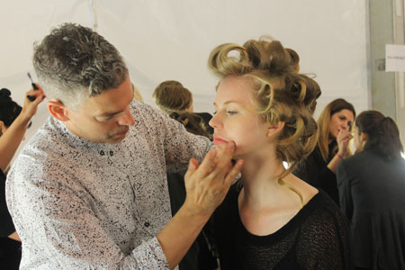 james-boehmer-blotting-lips-backstage-at-naeem-khan-ss15