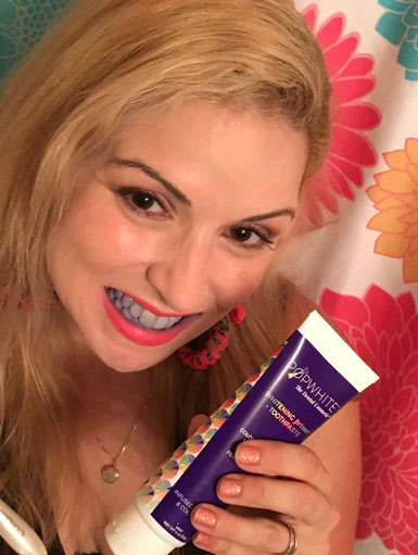 celia-san-miguel-using-popwhite-whitening-primer-toothpaste